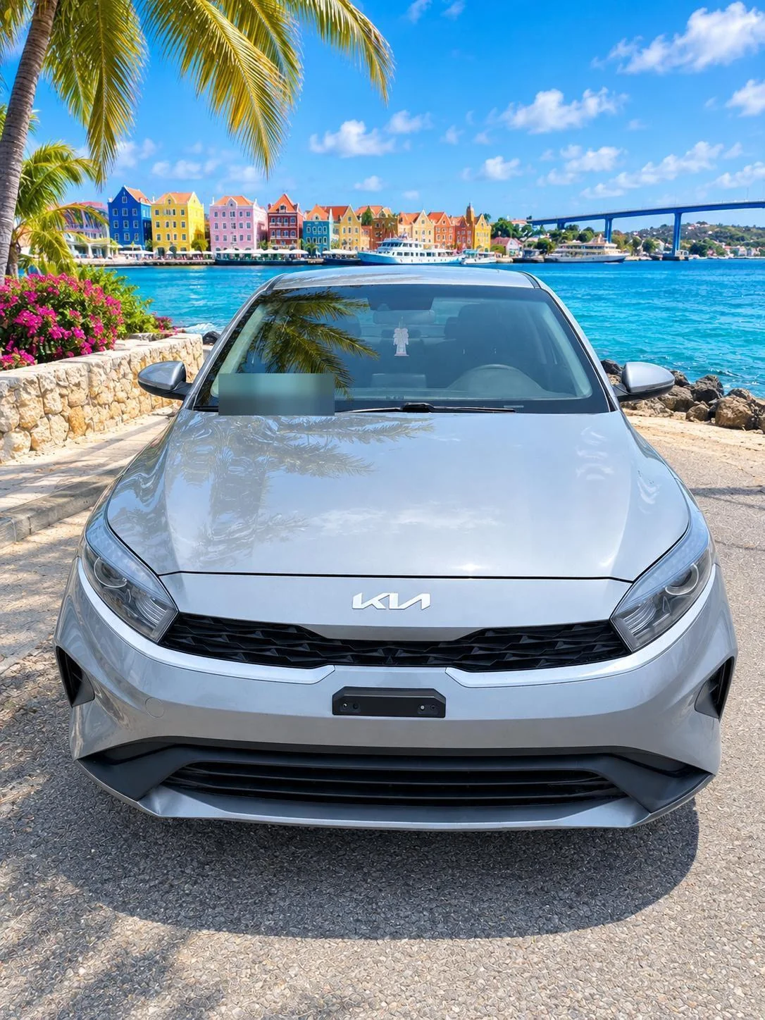 Silver Kia Forte sedan, front view