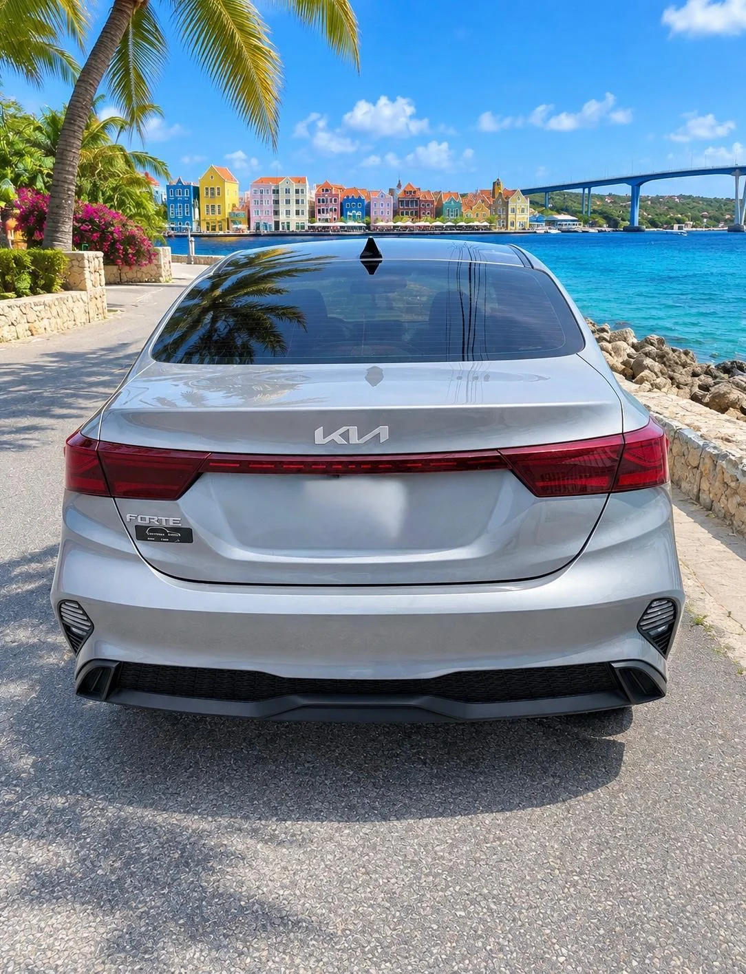Silver Kia Forte sedan, rear view