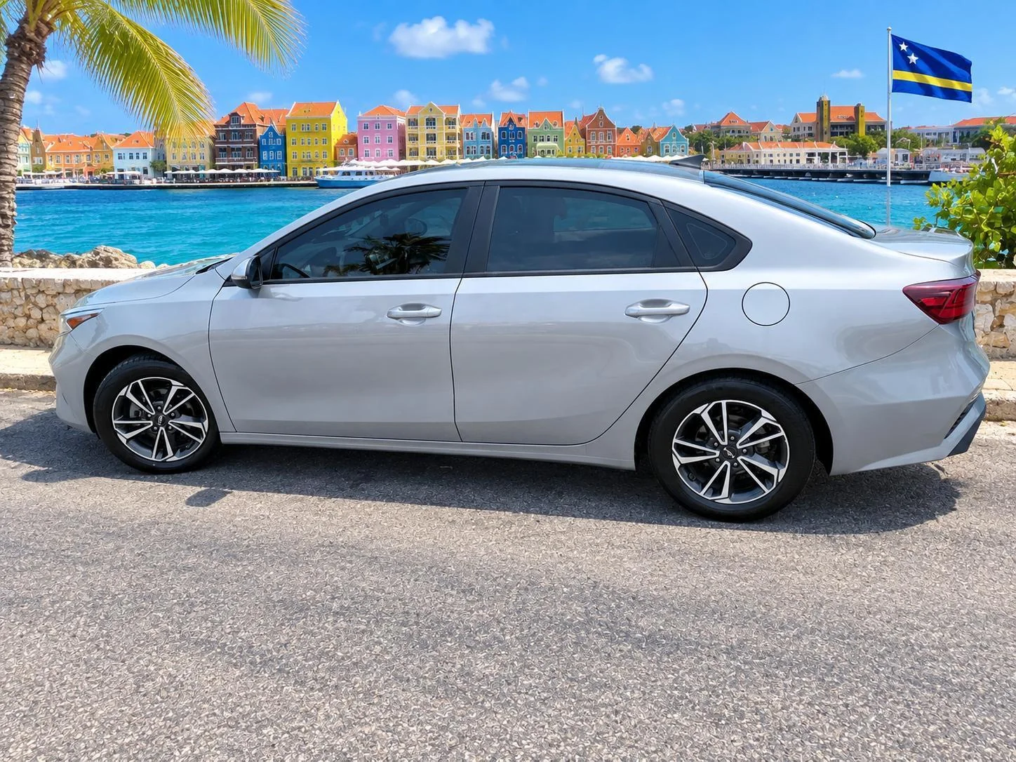 Silver Kia Forte sedan, side view